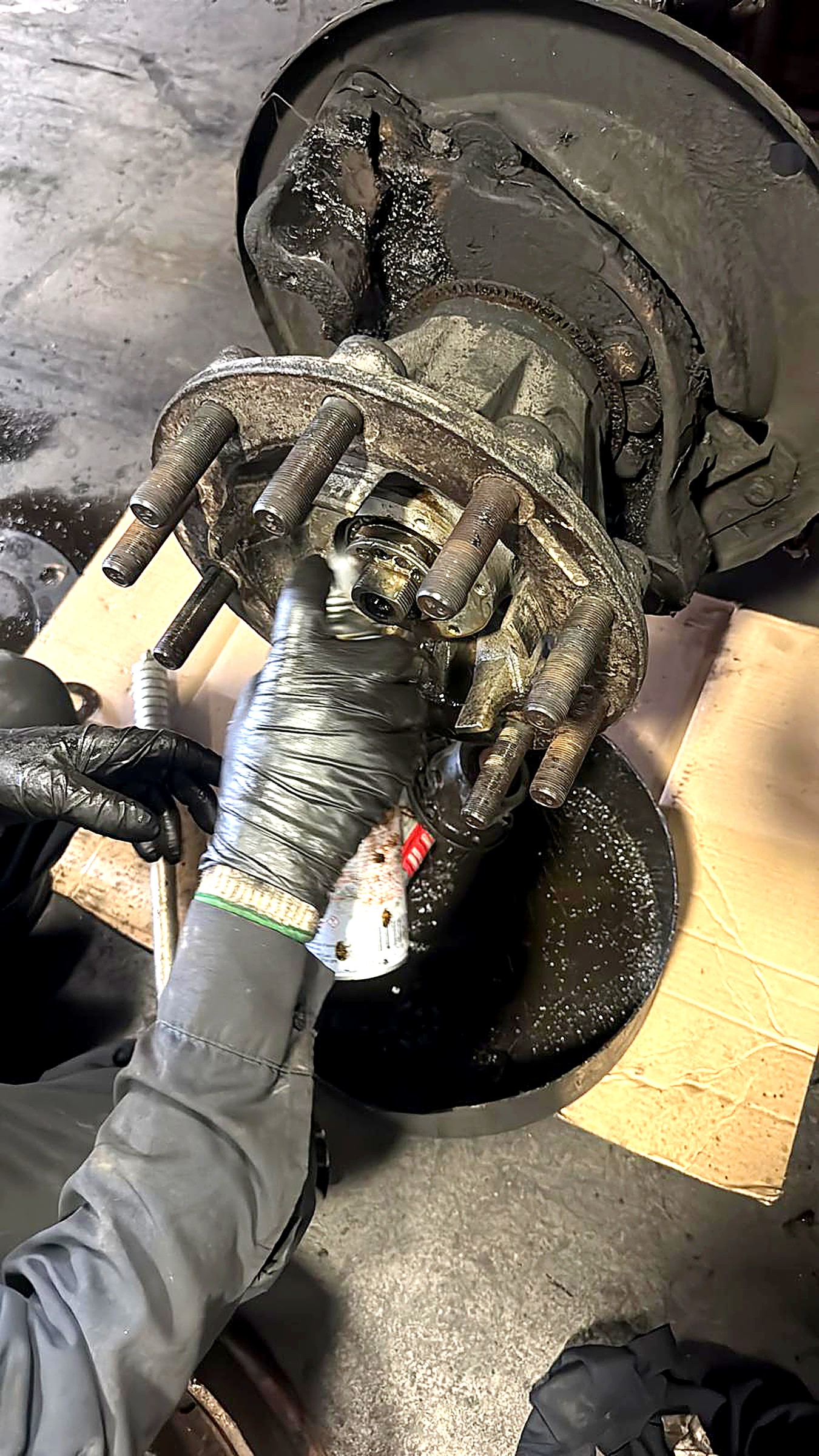 Technician servicing a wheel end