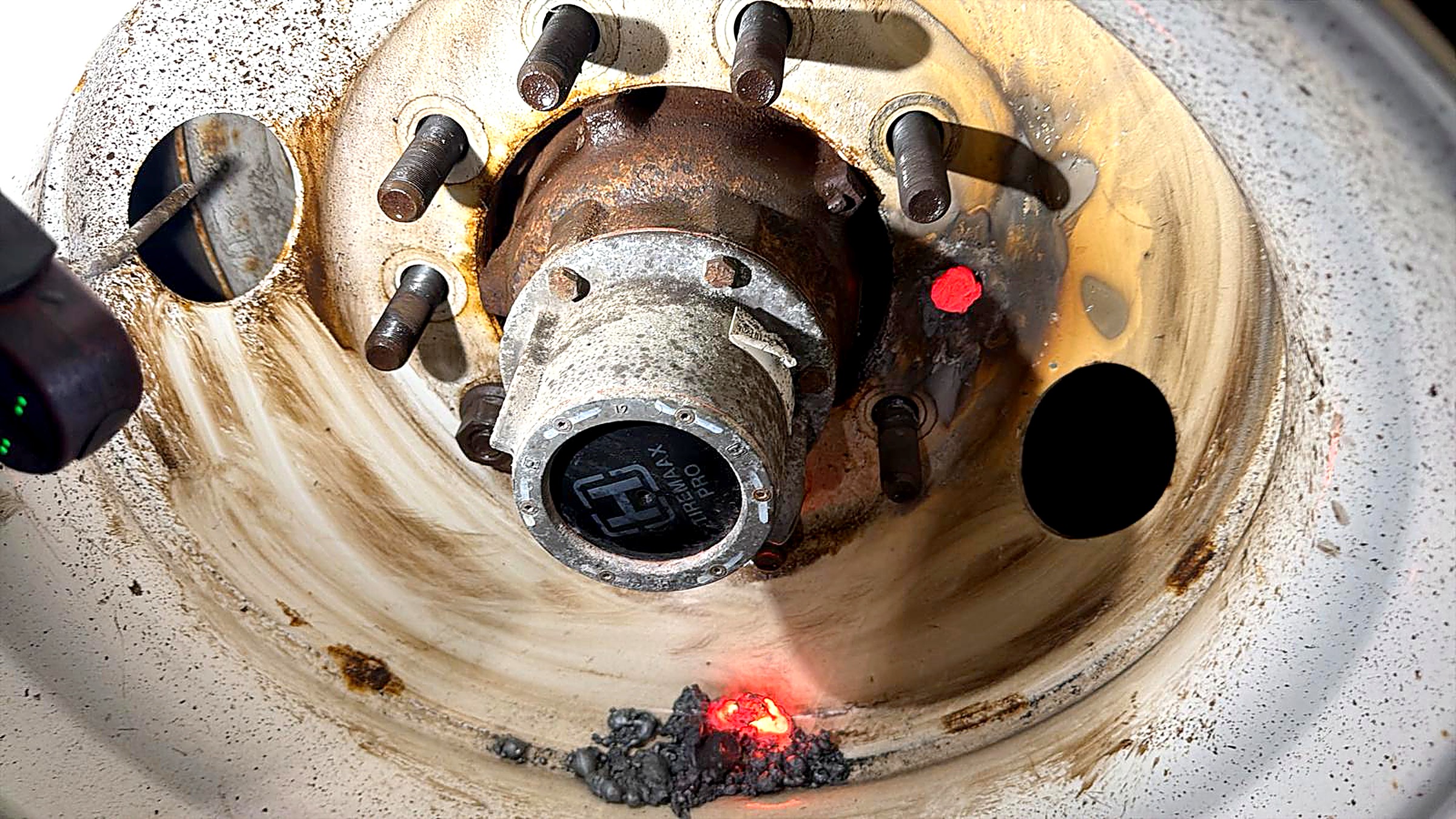 Trailer wheel hub and studs exposed during brake and bearing service